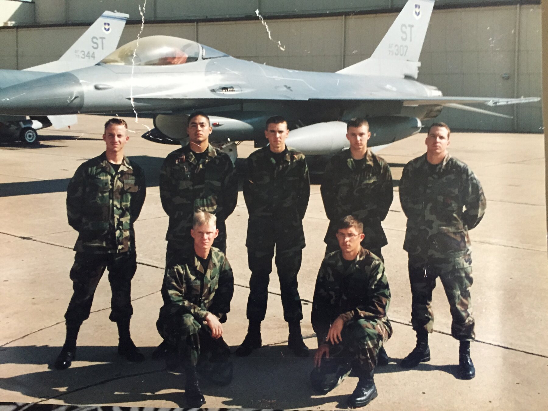 Daniel Elijah Vargas with fellow airmen in front of a fighter aircraft during his United States Air Force service